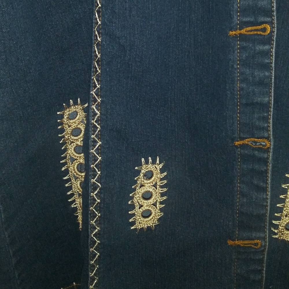 Long jean jacket with embroidery on it. No tags bu